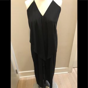 Olivaceous draped black dress.